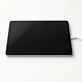 iPad in silver, front view with a dark screen and a charging cable plugged into the side
