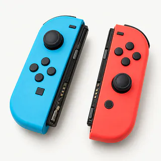 Nintendo Joy-Con controllers in blue and red, rail sides showing grimy metal contacts and a bent locking catch