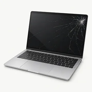 Laptop in silver, open front-left view with cracks spreading from the upper right of the black screen