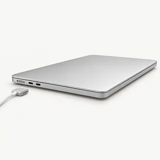 MacBook in silver, closed with left-side charging port visible and charging cable unplugged beside it