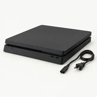 Black PS4 viewed from the front with no lights on and an unplugged power cable beside it