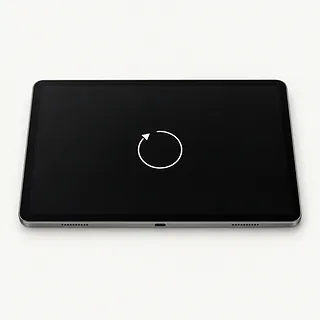 Tablet face up with a silver frame and a white circular arrow in the center of its black screen